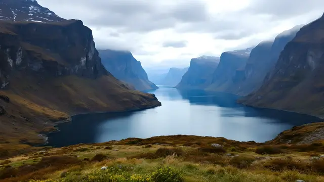 A calm fjord surrounded by steep cliffs