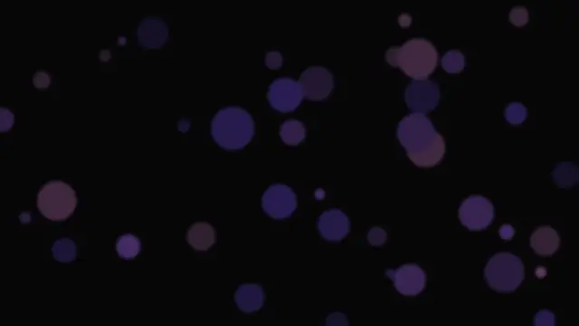 Soft circles of violet light scattered over black