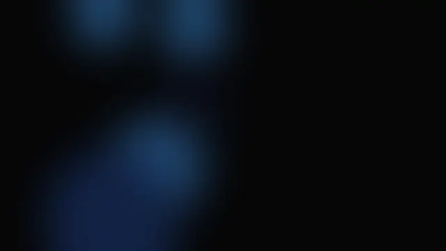 Soft blurred ice blue glow shapes over black