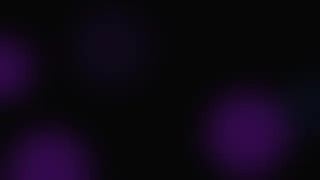 Soft blurred purple glow shapes over a black background