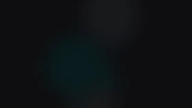 Soft blurred teal glow shapes over a near-black background