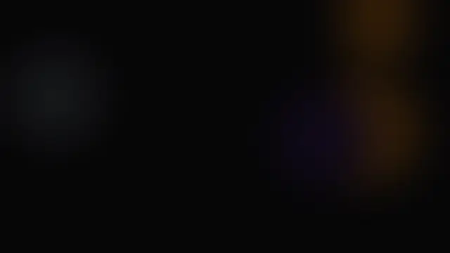 Soft blurred warm brown glow shapes over a black background