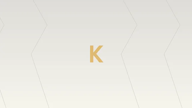 Gold K on a cream-to-grey chevron field