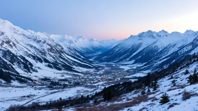 A snowy mountain valley at blue hour