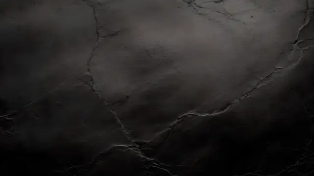 A black slate surface with subtle natural layers