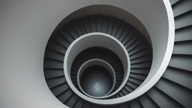 A plain spiral staircase from directly above