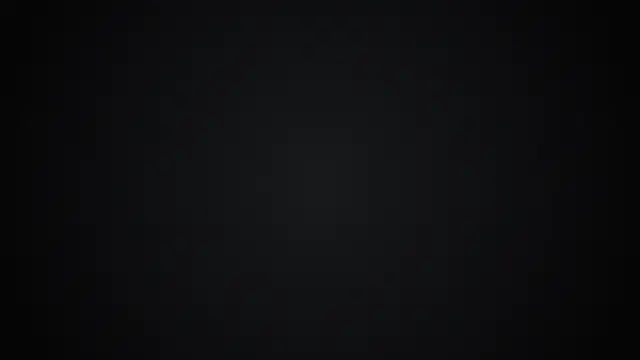 A gentle radial vignette from graphite to pure black