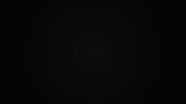 A soft radial vignette from near-black to pure black