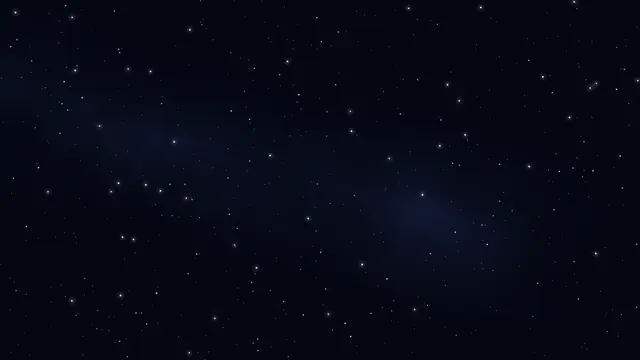 Stars over a dark blue night sky with a faint glow