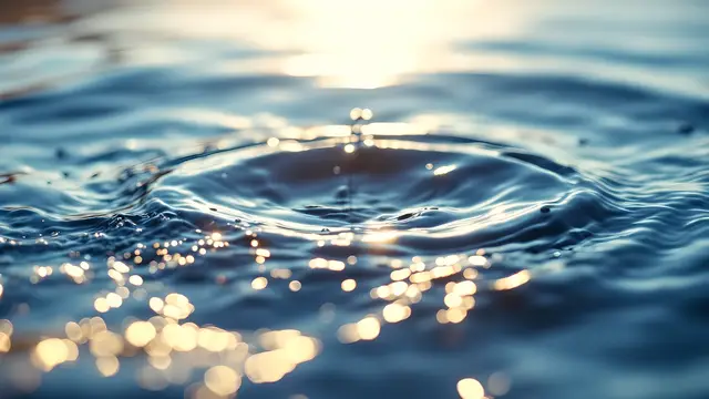 Gently rippling water lit from above in soft cool light